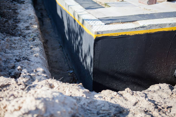 Professional Waterproofing technician working in Lake Elmo, MN